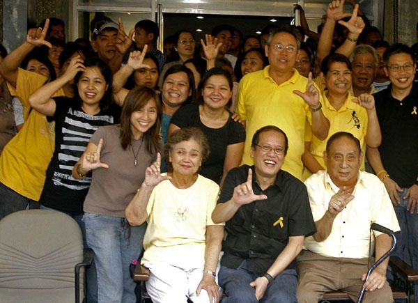 LABAN. At the main entrance of the JVAMC office in Juna Subdivision, Davao City, then Senator Benigno "Noynoy" Aquino poses with supporters, including his "Tito Chito," Jesus V. Ayala (to his left) and Ayala's wife Mafe (to his right) and son Miguel (standing behind him) on September 3, 2009, when Noynoy was en route to Zamboanga City for a retreat at the Carmelite nuns' convent to decide whether or not he would run for President. MindaNews photo by Keith Bacongco