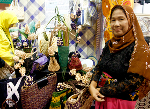 Hadja Sarika Pendatun with the woven products made from stalks of water hyacinths at the Mindanao Trade Expo 2010 in Davao City. MindaNews Photo by Keith Bacongco