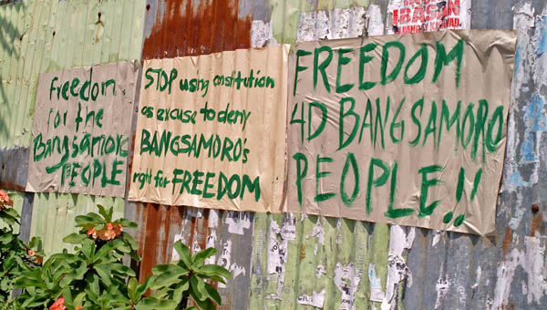 SIGNS OF THE TIMES. Supporters of the Moro Islamic Liberation Front's struggle for self-determination express their sentiments on the government's proposal through messages pasted on walls along some streets in Cotabato City. MIndaNews photo by Toto Lozano