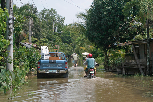 Although flood waters have receded, the roads at Crislamville in Barangay Rosary Heights 6 in Cotabato City are still covered with water. Heavy rains in the past days have affected 16 towns in Maguindanao. MindaNews photo by Gigi Bueno
