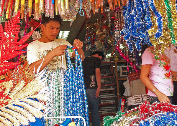CHRISTMAS. Store attendants in Kidapawan City prepare Christmas decorations for sale on Wednesday, Oct. 5, 2011. MindaNews photo by Geonarri Solmerano