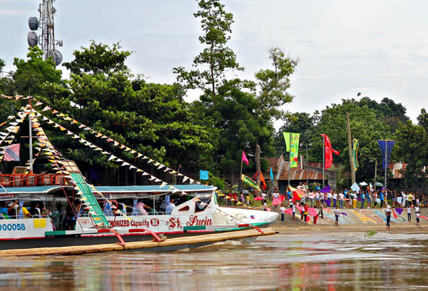 FLUVIAL PROCESSION. A decorated boat traverses the Agusan River in Barangay Agao, Butuan City during the feast of St. Anne on July 29, 2012. MindaNews photo by Erwin Mascarinas