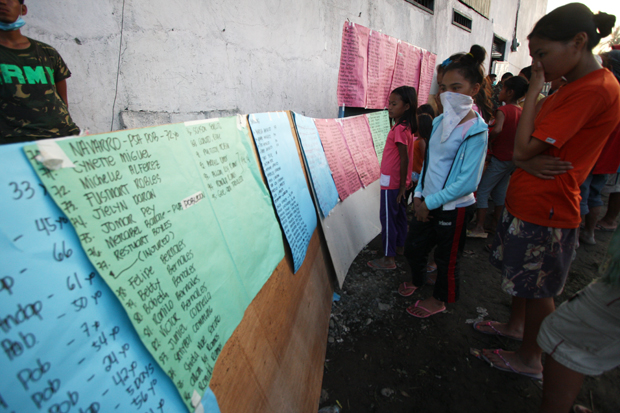 The names of the missing persons posted at the incident command post in New Bataan, Compostela Valley province. Mindanews Photo by Ruby Thursday More