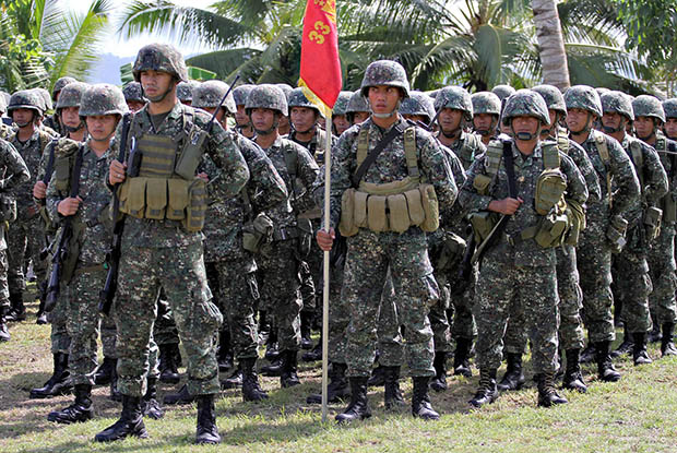 PRESIDENTIAL MUSCLE. Marine Battalion Landing Team 3 troops stand in attention during their arrival presentation held at the Army camp in Bancasi, Butuan City on April 23, 2013. The Marines are deployed on orders of President Aquino to counter the threat of the communist rebels following the ambush of Gingoog Mayor Ruthie Guingona. MindaNews photo by Erwin Mascarinas