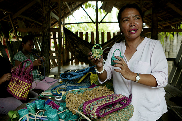 Elma Guiambangan shows some of their handicraft products made from buri leaves in Bai Matabay Plang Village, Kabacan, North Cotabato on 28 August 2013. Mindanews Photo by Keith Bacongco