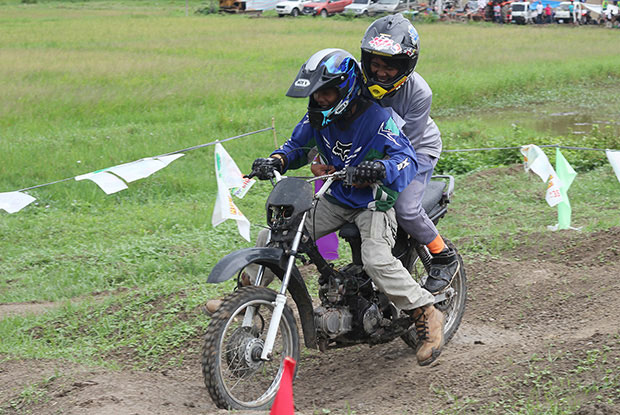 Riders navigate through the whoops during the motocross race in Midsayap, North Cotabato on Saturday. This category, known as"XRM Angkas," is the most entertaining category in the race. The motocross is one of the main hightlights of the Halad Festival. Mindanews Photo by Keith Bacongco