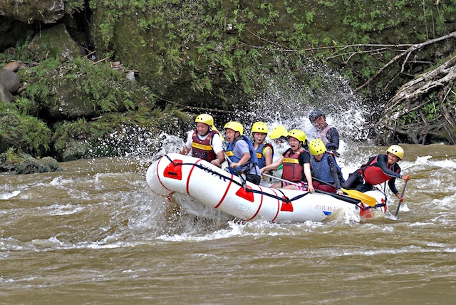 BUSINESS AS USUAL. Tourists enjoy their adventure in the Cagayan de Oro river on Saturday, June 14, ignoring the ongoing search for the body of a missing tourist who fell into the raging waters on Friday. MindaNews photo by Erwin Mascarinas