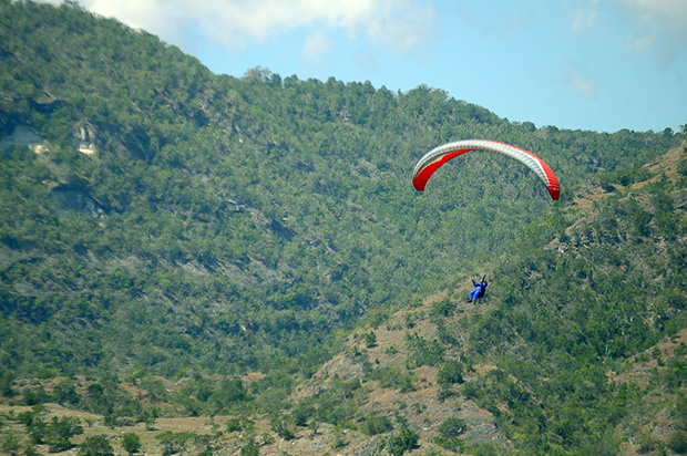 A paraglider prepares to touch down at the landing site in SAFI Ranch 1 in barangay Seguil in Maasim town after flying over Sarangani Bay. File Photo courtesy of Cocoy Sexicon / Saragani PIO