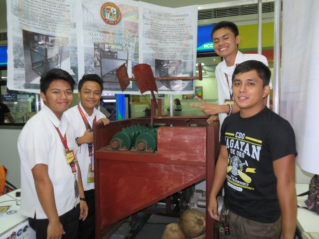 BS agricultural engineering graduate Allan Paul Salutillo (rightmost), 22, guides three students from the University of Southeastern Philippines (USEP) in Tagum to make an electric coconut dehusker. The group is also mentored by the dean of USEP's college of agriculture and related sciences Dr. Roger Montepio. MindaNews photo by Jesse Pizarro Boga