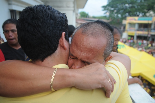 RELIEF. Cagayan de Oro Mayor Oscar Moreno embraces his son after the Court of Appeals on Friday issued a “status quo ante” order giving him a 60-day reprieve. MindaNews photo by Froilan Gallardo