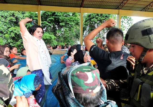LTENSION IN MADALUM. Army soldiers figure in a scuffle with female supporters of a local candidate who were trying to prevent the delivery of the vote counting machines in Madalum town, Lanao del Sur on Friday, May 6, 2016. MindaNews photo by FROILAN GALLARDO