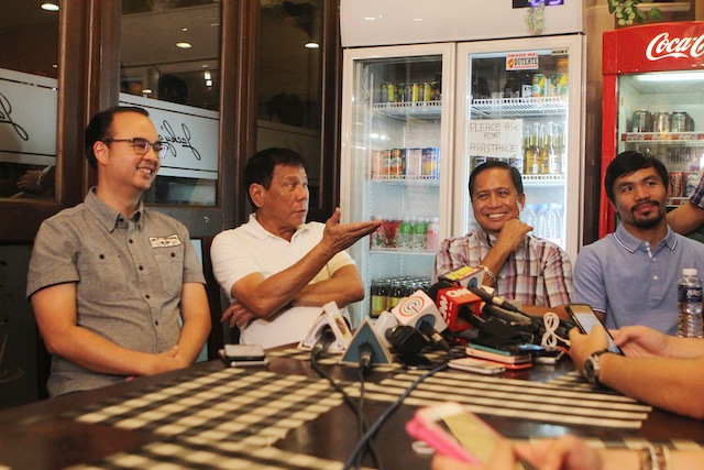 Incoming president Rodrigo Duterte faces the media Saturday night in Davao City. With him are Senator Alan Peter Cayetano, with returning Presidential Adviser on the Peace Process  Jesus Dureza and senator-elect Manny Pacquiao. Mindanews photo by KEITH BACONGCO