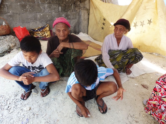 GRANDMAS, GRANDSONS. Sisters Saria Namawog and Cartiquia Cartin with Saria’s grandsons, Mohaleddin, 12 and Mohammedin 10 in an evacuation center in a Maguindanao town in 2015. The grandmas can no longer count the number of times they have had to evacuate due to armed conflict. They say they are too old to evacuate. MindaNews file photo by Carolyn O. Arguillas