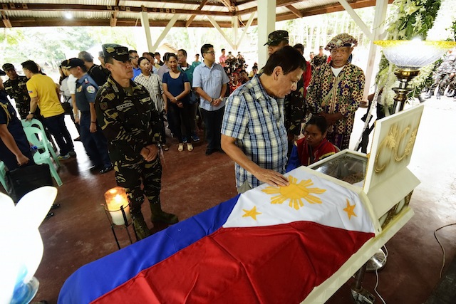 President Rodrigo Duterte attends the wake of CAFGU member Panggong Komanod in the 60th Infantry Battalion's camp in Asuncion, Davao del Norte on Friday, July 29, 2016. Pumanod was killed in an ambush by the New People’s Army in Kapalong, Davao del Norte on Wednesday, July 27, 2016. RENE LUMAWAG/PPD