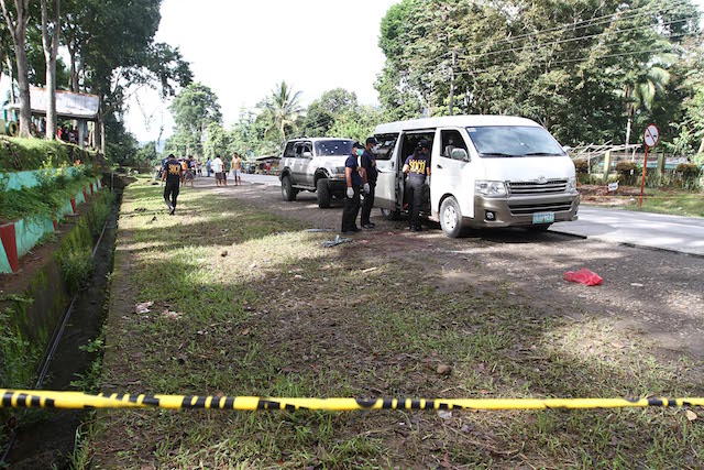 Scene of the Crime operatives search for evidence inside a van following an alleged encounter between the group of suspected druglord Mayor Samsudin Dimaukom of Datu Saudi Ampatuan town in Maguindanao and the police in Makilala, North Cotabato early morning of October 28, 2016. Dimaukom and nine others were killed. Mindanews Photo 